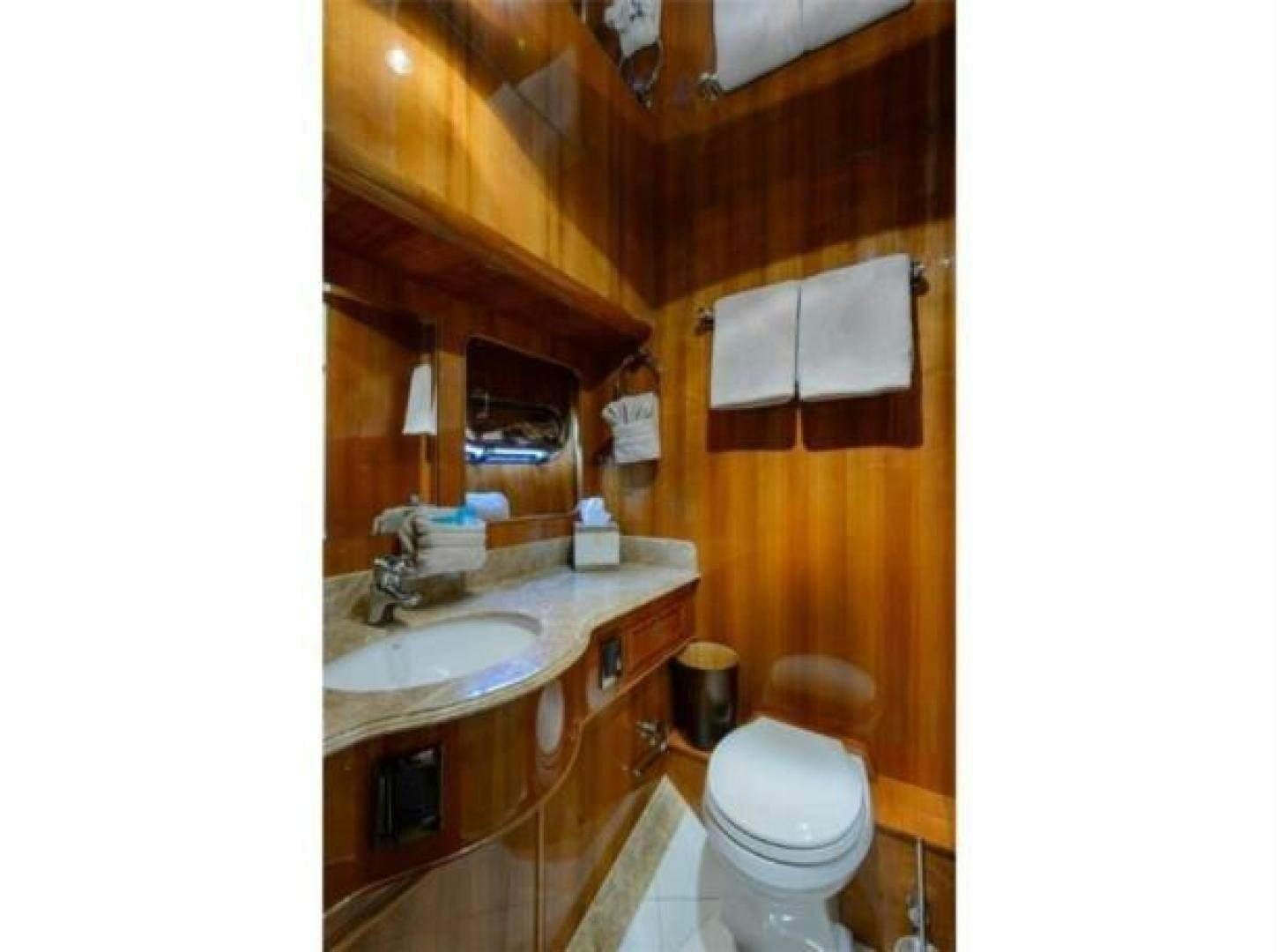 a bathroom with a sink and toilet aboard PRIMETIME Yacht for Sale