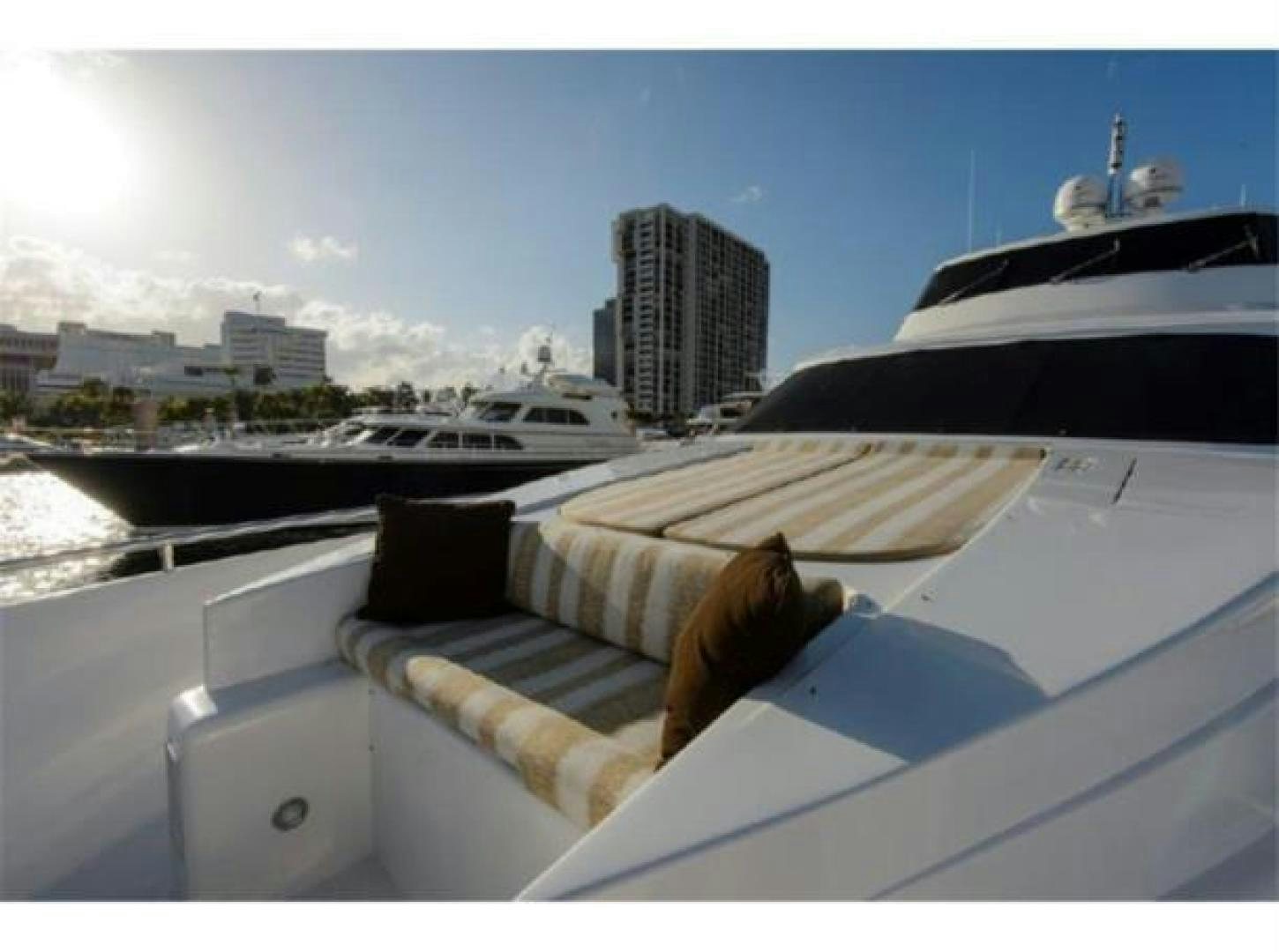 a cat lying on a couch on a boat aboard PRIMETIME Yacht for Sale