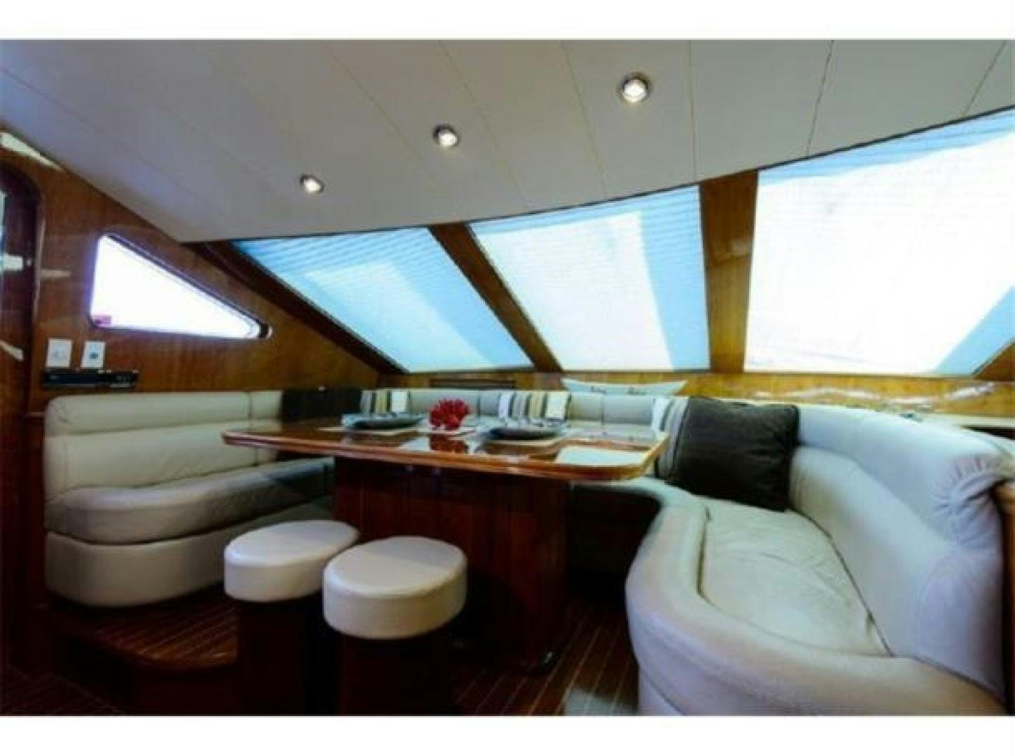 a room with a bed and a desk aboard PRIMETIME Yacht for Sale