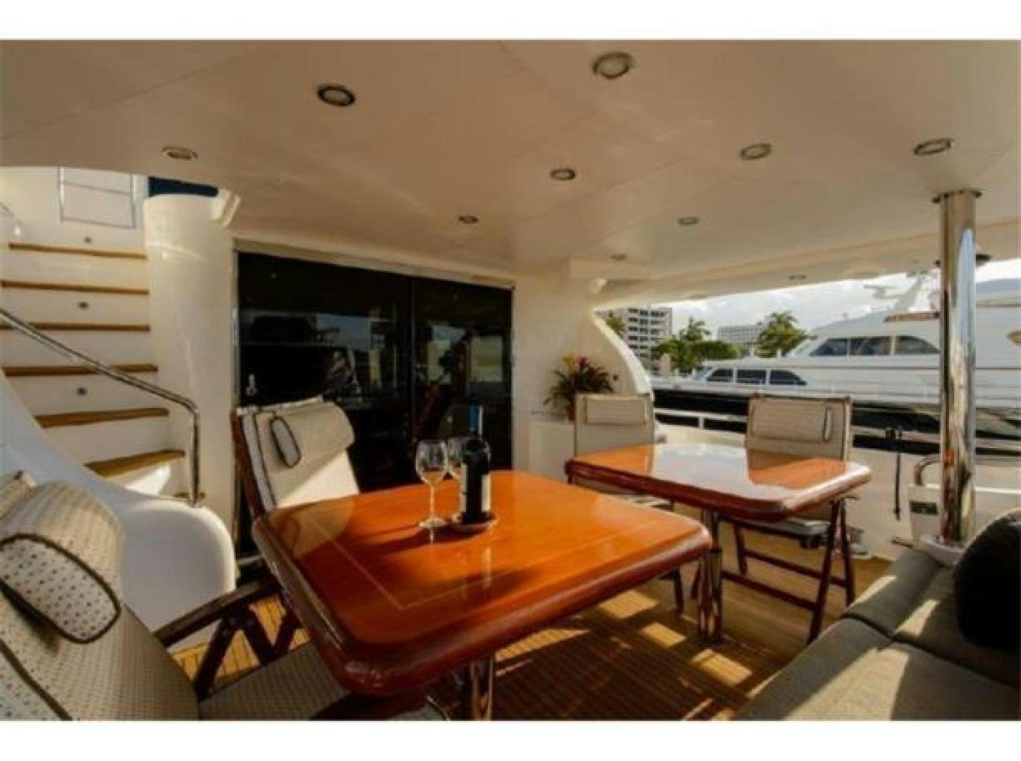 a table and chairs in a room aboard PRIMETIME Yacht for Sale