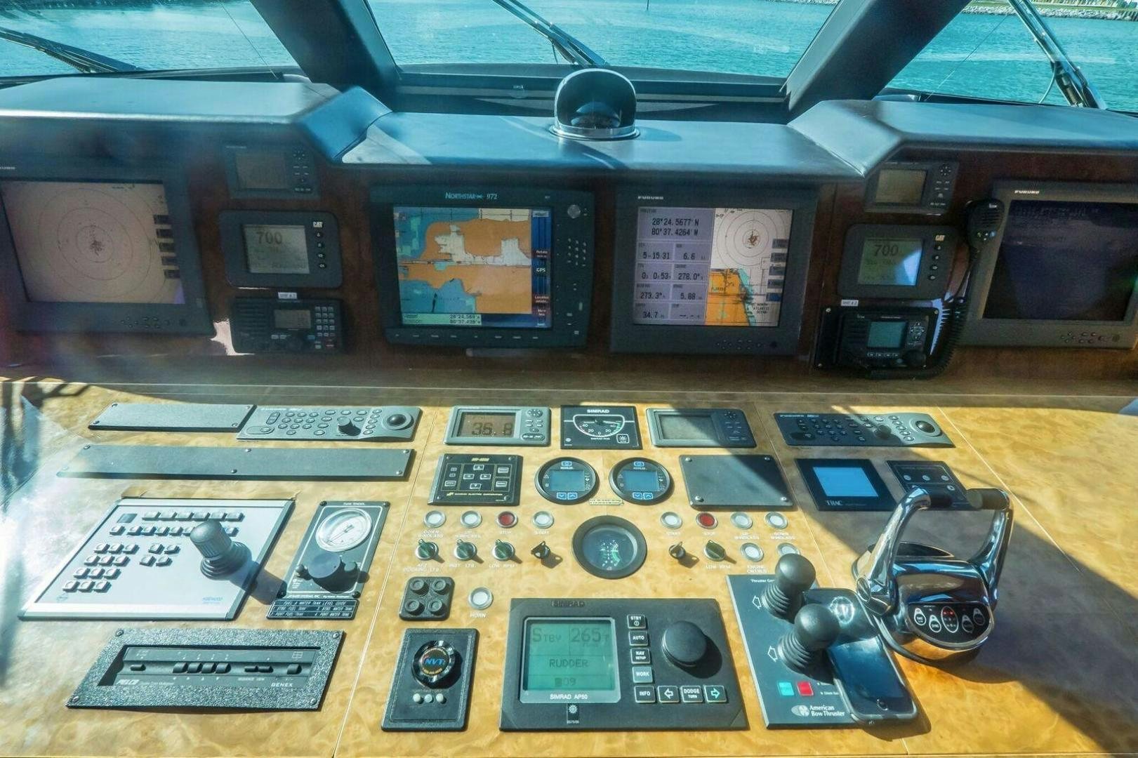 a table with electronic devices aboard PRIMETIME Yacht for Sale