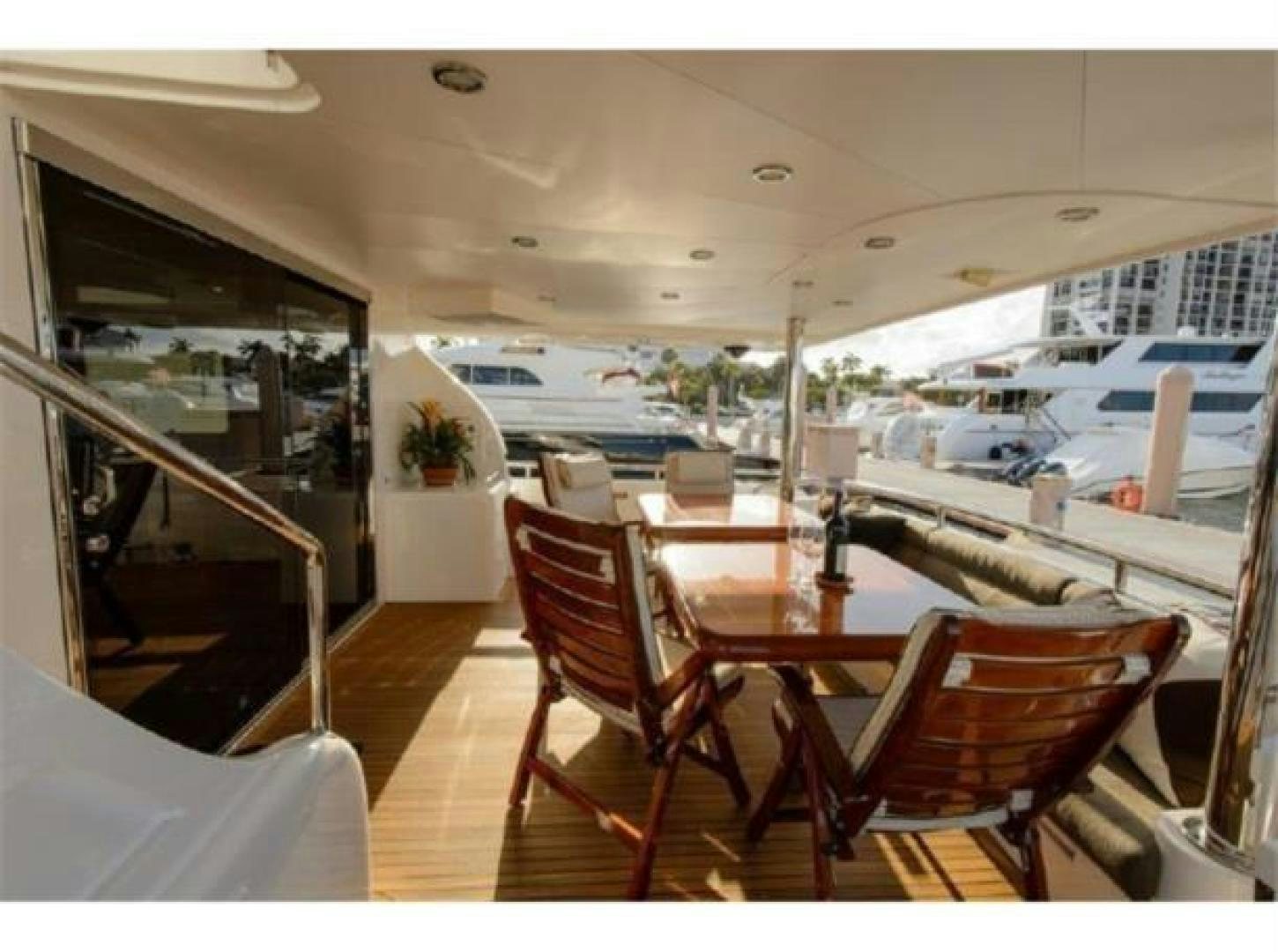 a table and chairs on a boat aboard PRIMETIME Yacht for Sale