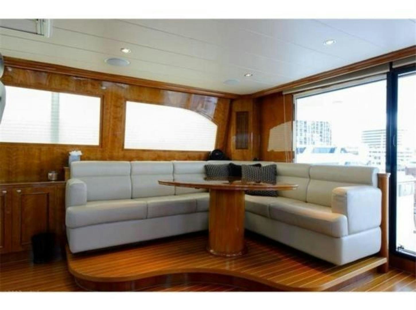 a living room with a couch and a coffee table aboard PRIMETIME Yacht for Sale
