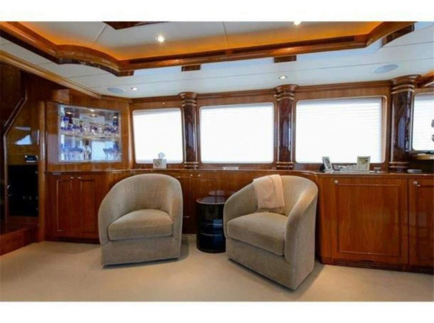 a room with a chair and a couch aboard PRIMETIME Yacht for Sale