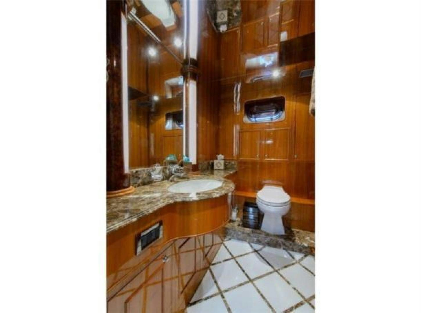 a bathroom with a sink and toilet aboard PRIMETIME Yacht for Sale