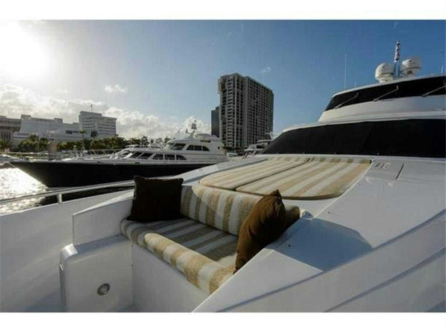 a cat lying on a couch aboard PRIMETIME Yacht for Sale
