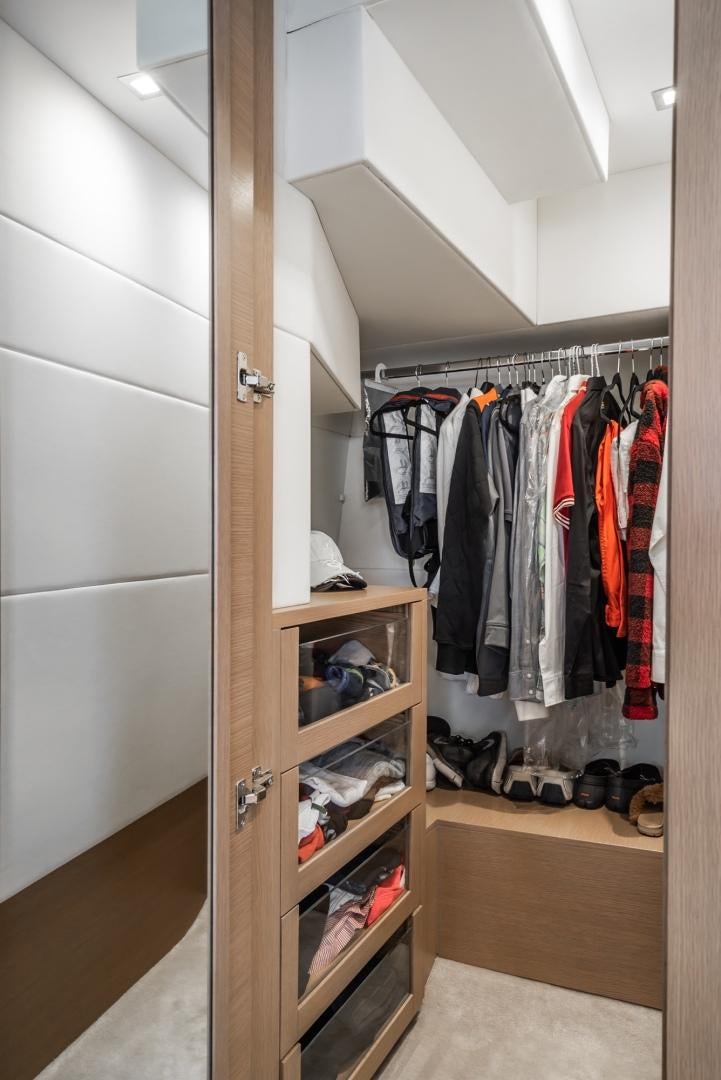 a closet with clothes and shoes aboard NO NAME Yacht for Sale