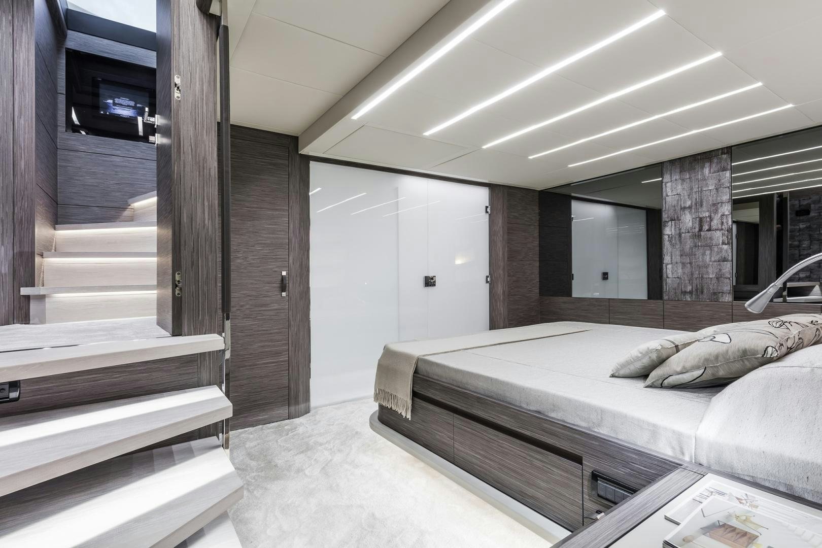 a room with a bed and a television aboard NO NAME Yacht for Sale