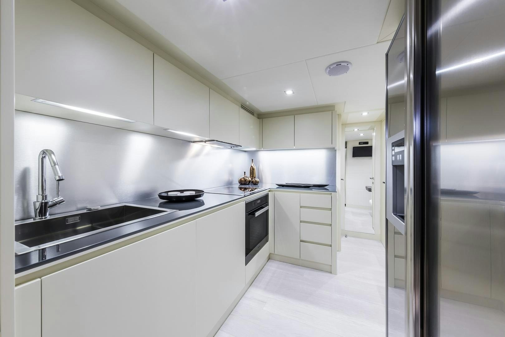 a kitchen with white cabinets aboard NO NAME Yacht for Sale