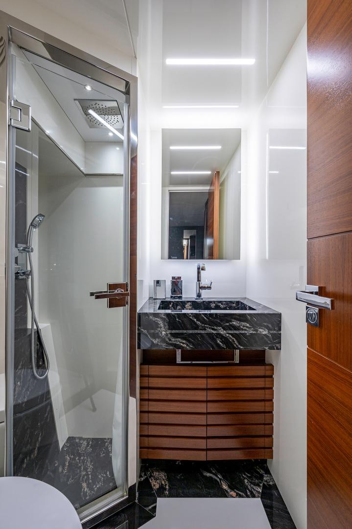 a bathroom with a sink and a mirror aboard No Name Yacht for Sale