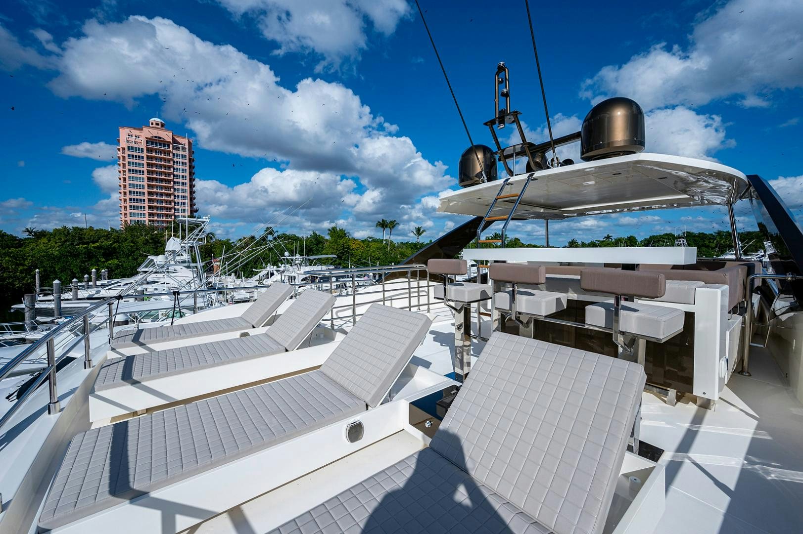 a large white boat with a large round top on a dock aboard No Name Yacht for Sale