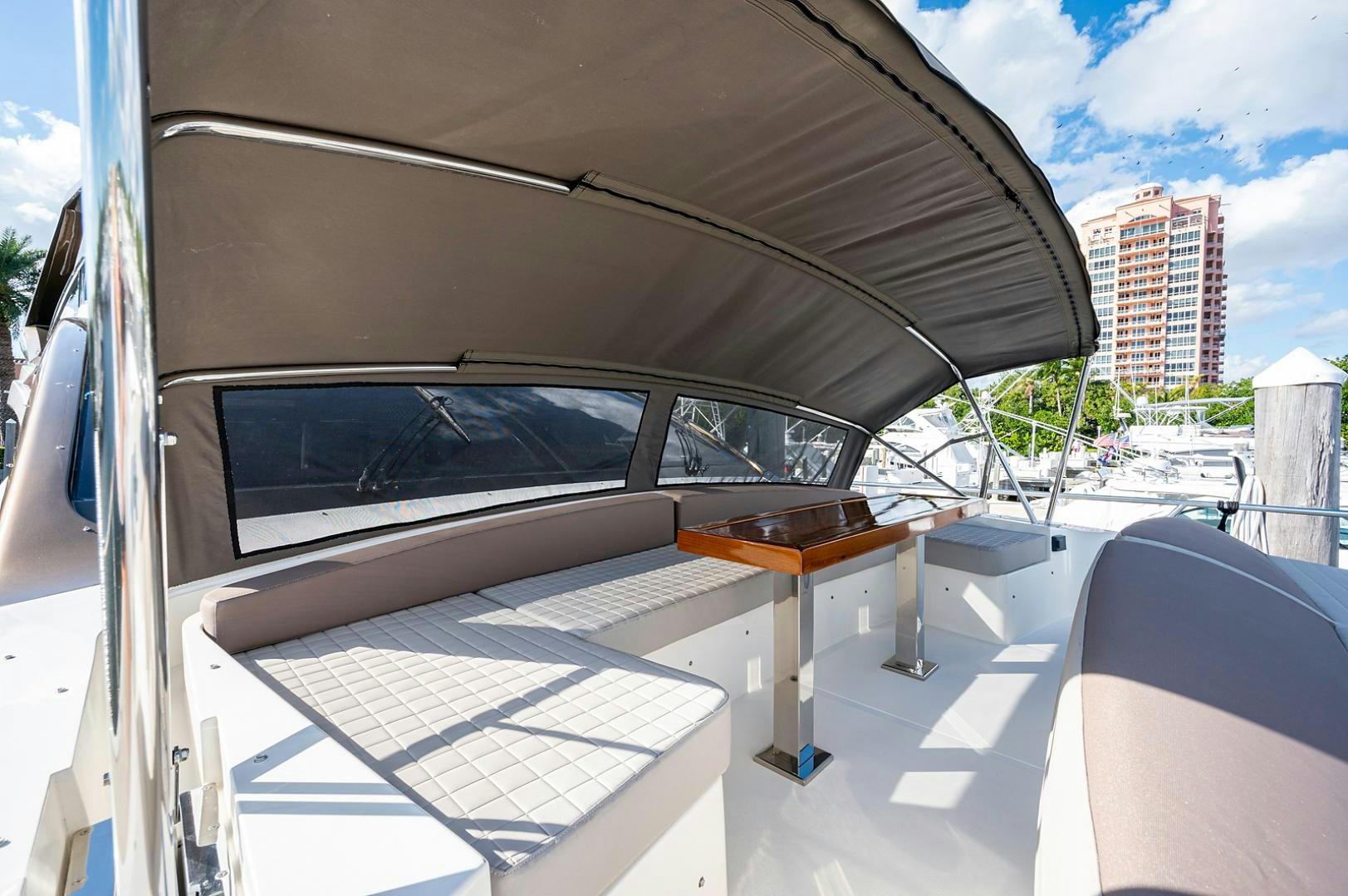 a white car with a wooden table aboard No Name Yacht for Sale