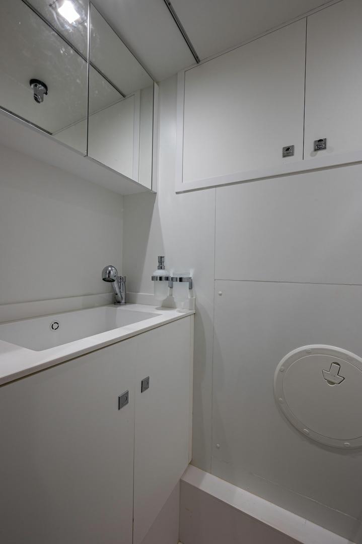 a bathroom with a toilet and sink aboard No Name Yacht for Sale