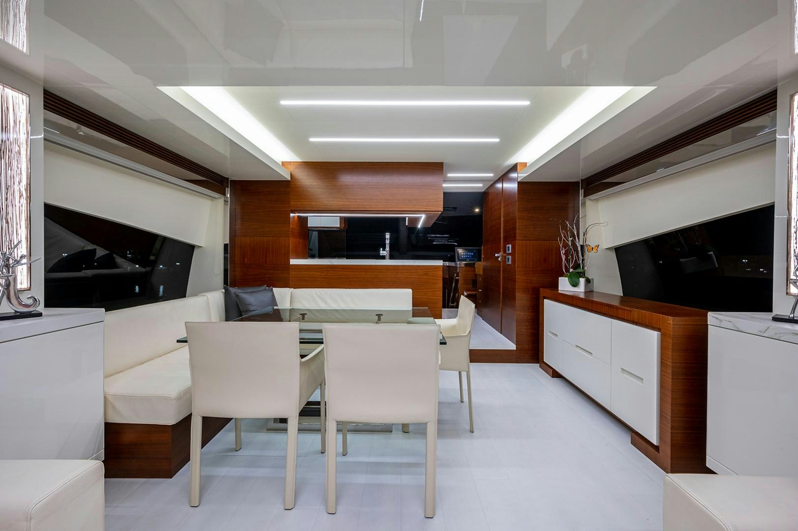 a room with a table and chairs aboard No Name Yacht for Sale