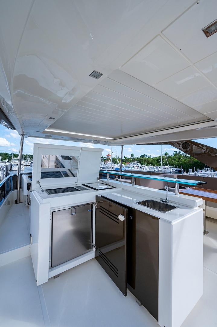 a kitchen with a large white ceiling aboard No Name Yacht for Sale
