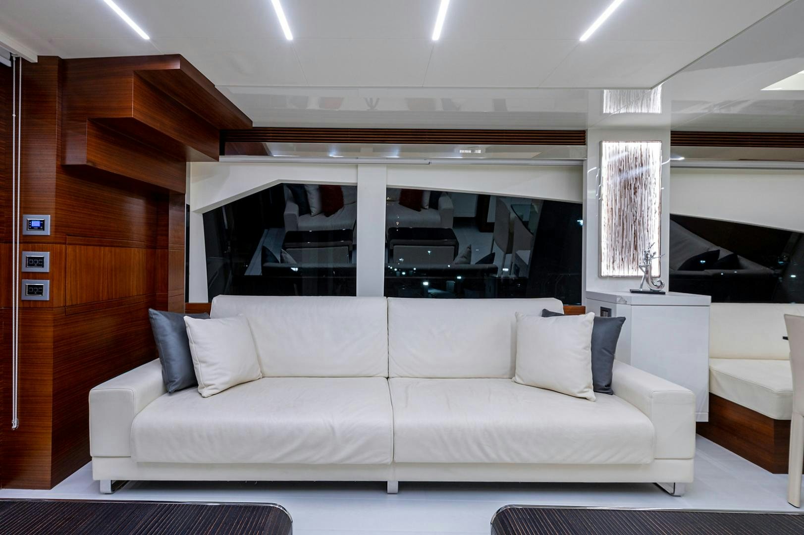 a white couch in a room aboard No Name Yacht for Sale