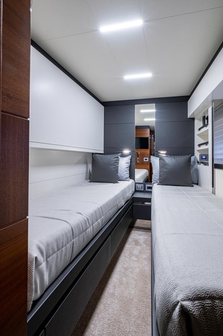 a room with a bed and a mirror aboard No Name Yacht for Sale