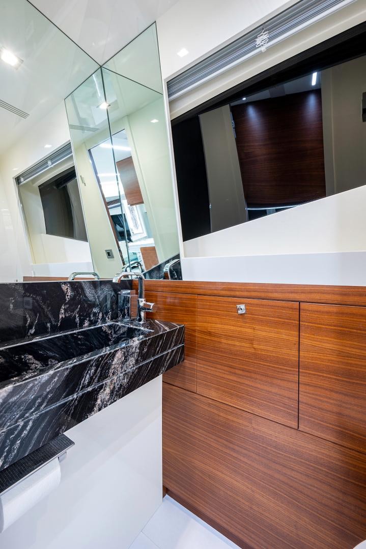 a bathroom with a large mirror aboard No Name Yacht for Sale
