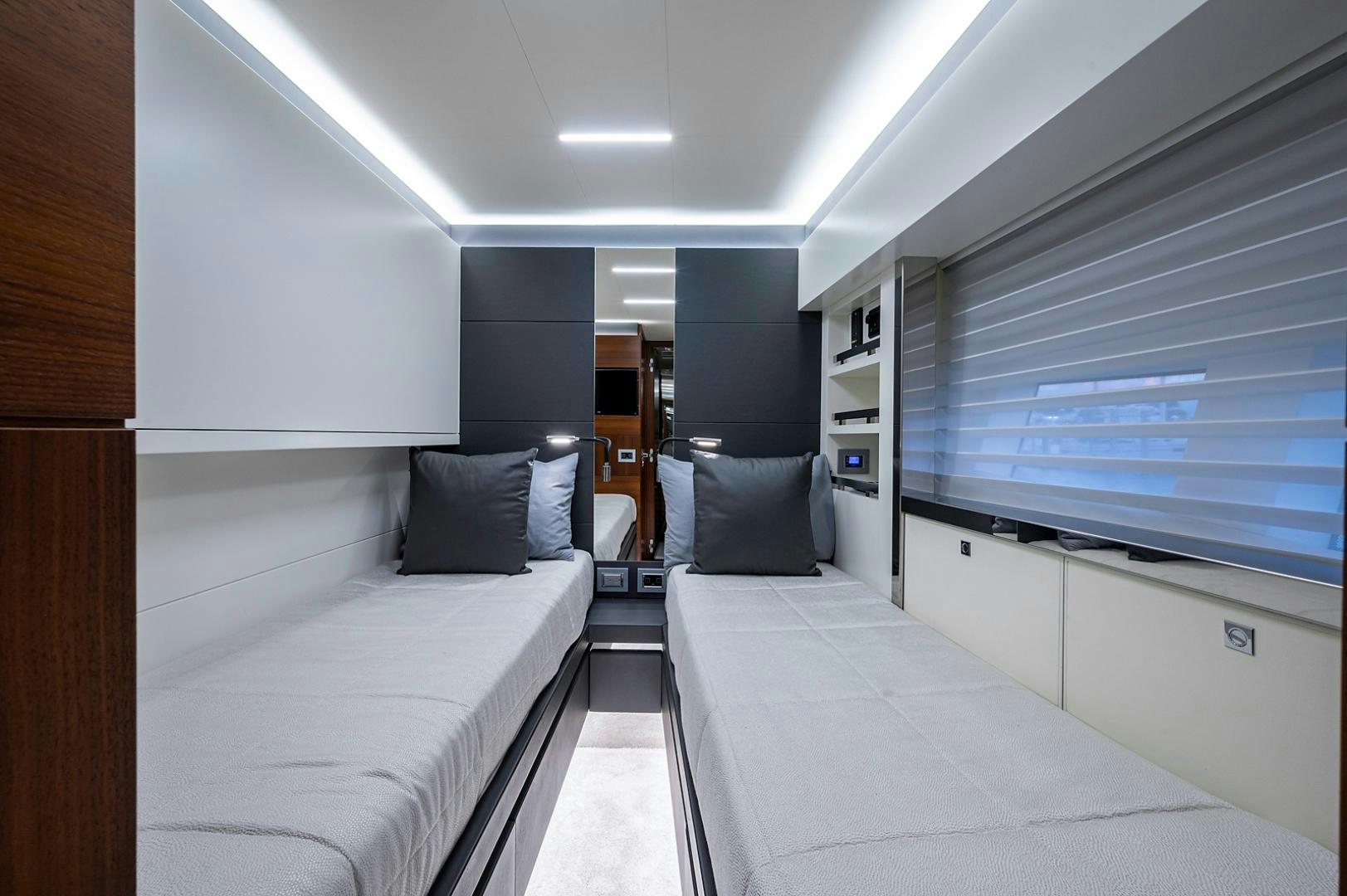 a room with a bed and a desk aboard No Name Yacht for Sale