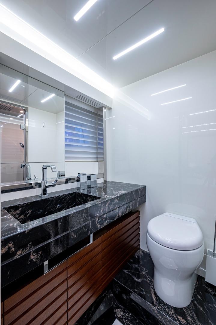 a bathroom with a marble counter top aboard No Name Yacht for Sale
