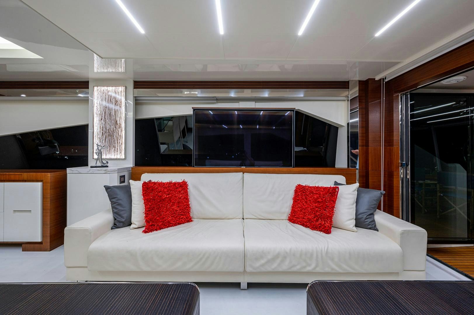 a white couch with pillows aboard No Name Yacht for Sale