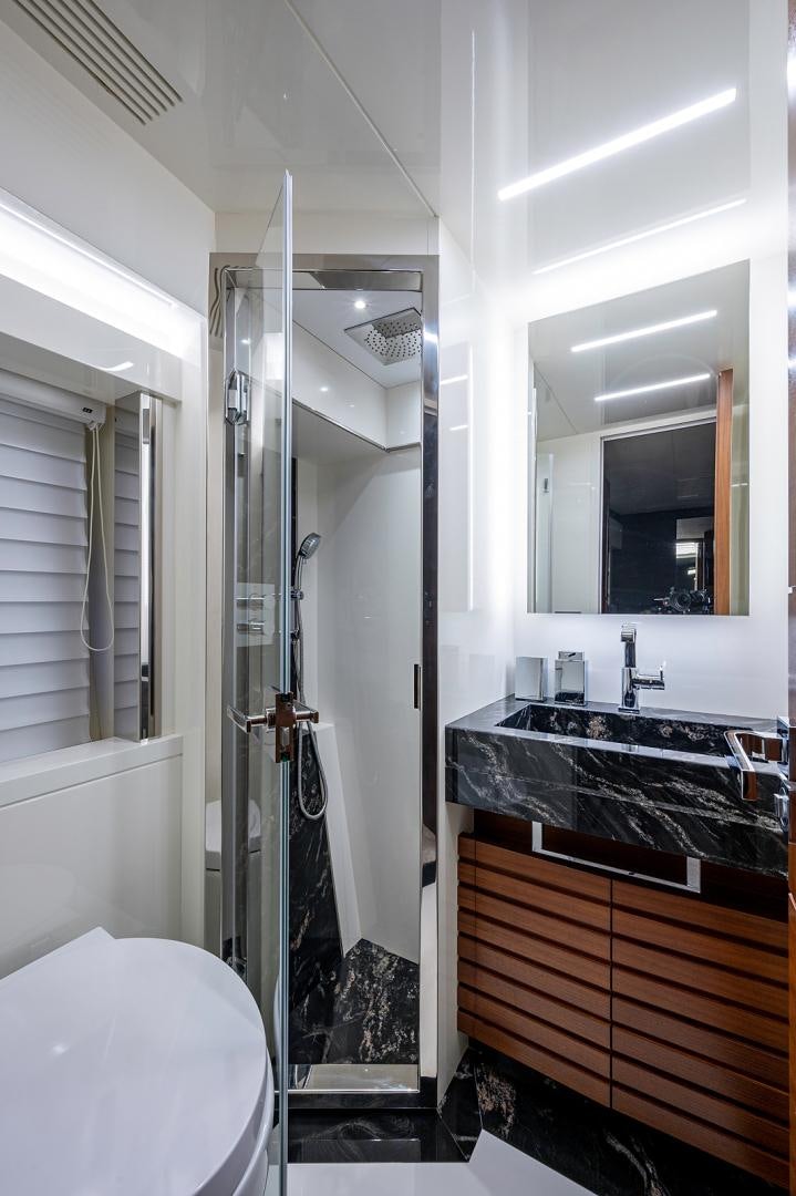 a bathroom with a shower and sink aboard No Name Yacht for Sale