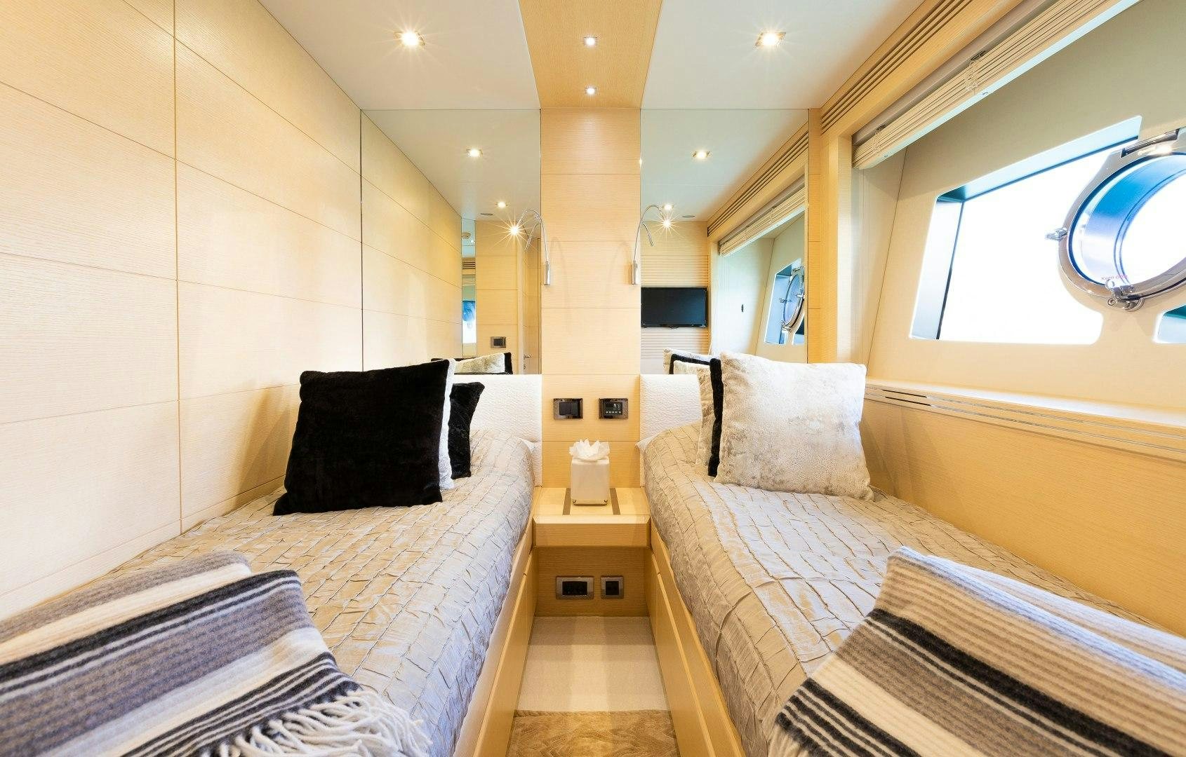 a room with two beds aboard SKYFALL Yacht for Sale