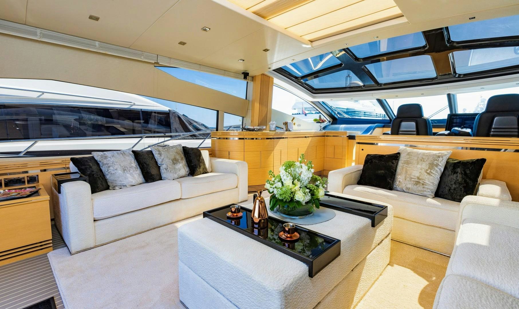 a living room with a couch and a coffee table aboard SKYFALL Yacht for Sale