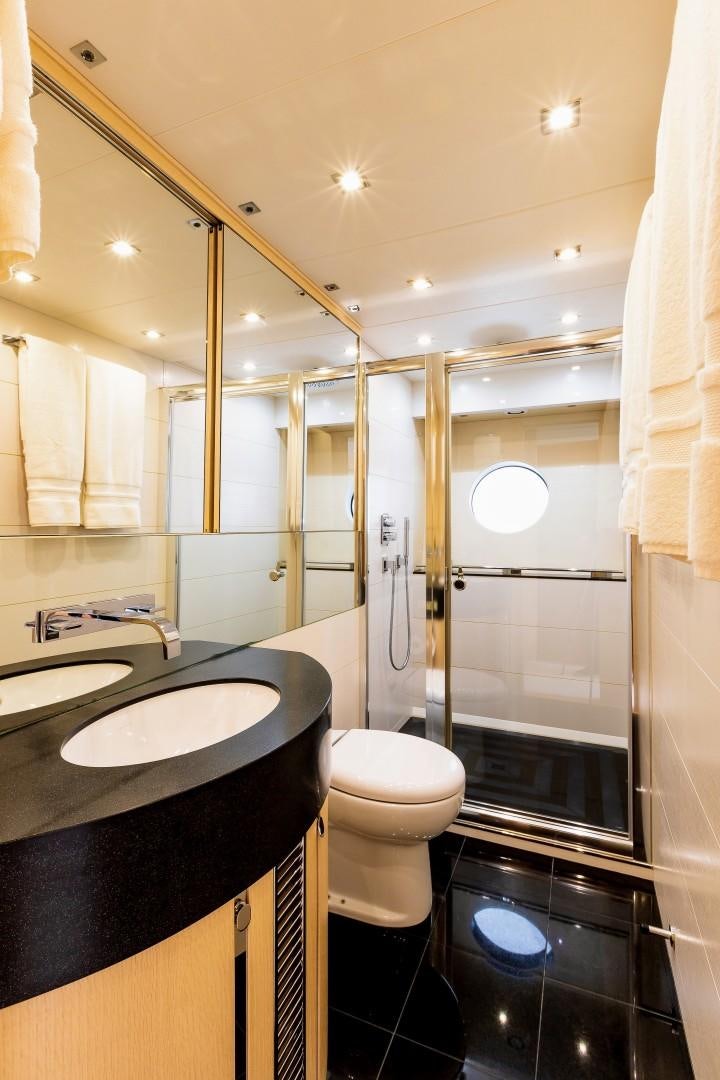 a bathroom with a sink and a toilet aboard SKYFALL Yacht for Sale