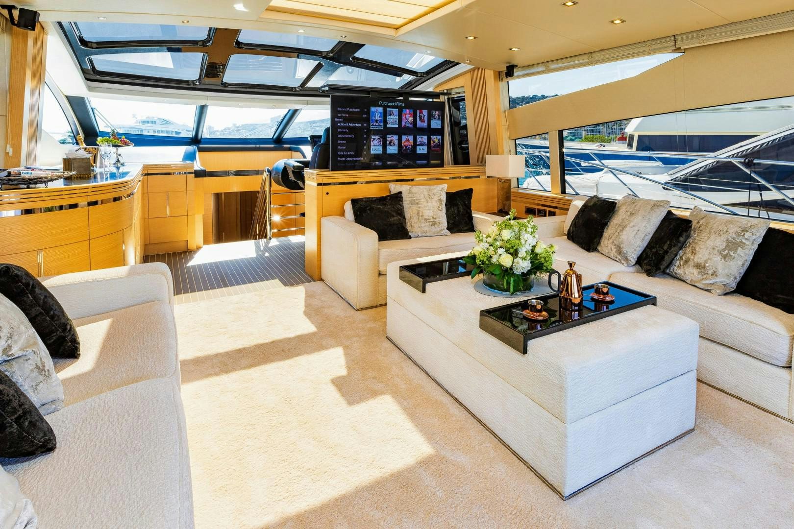 a living room with a couch and a coffee table aboard SKYFALL Yacht for Sale
