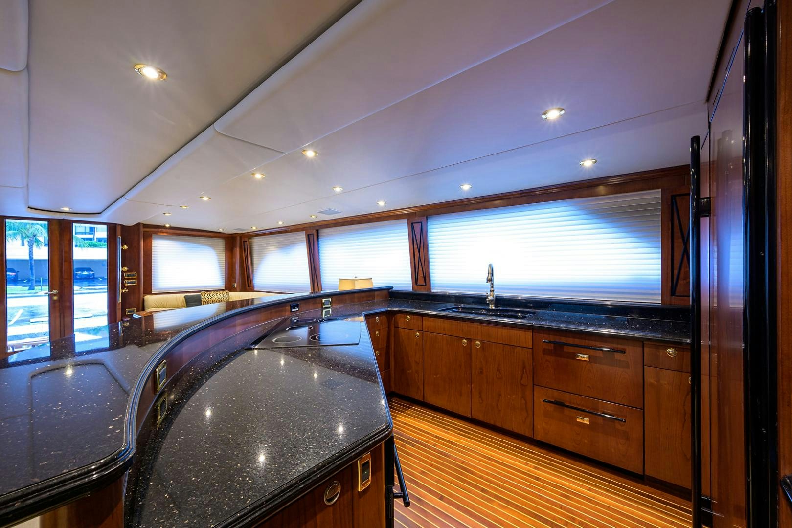 a kitchen with a large island aboard BLACK SHADOW Yacht for Sale