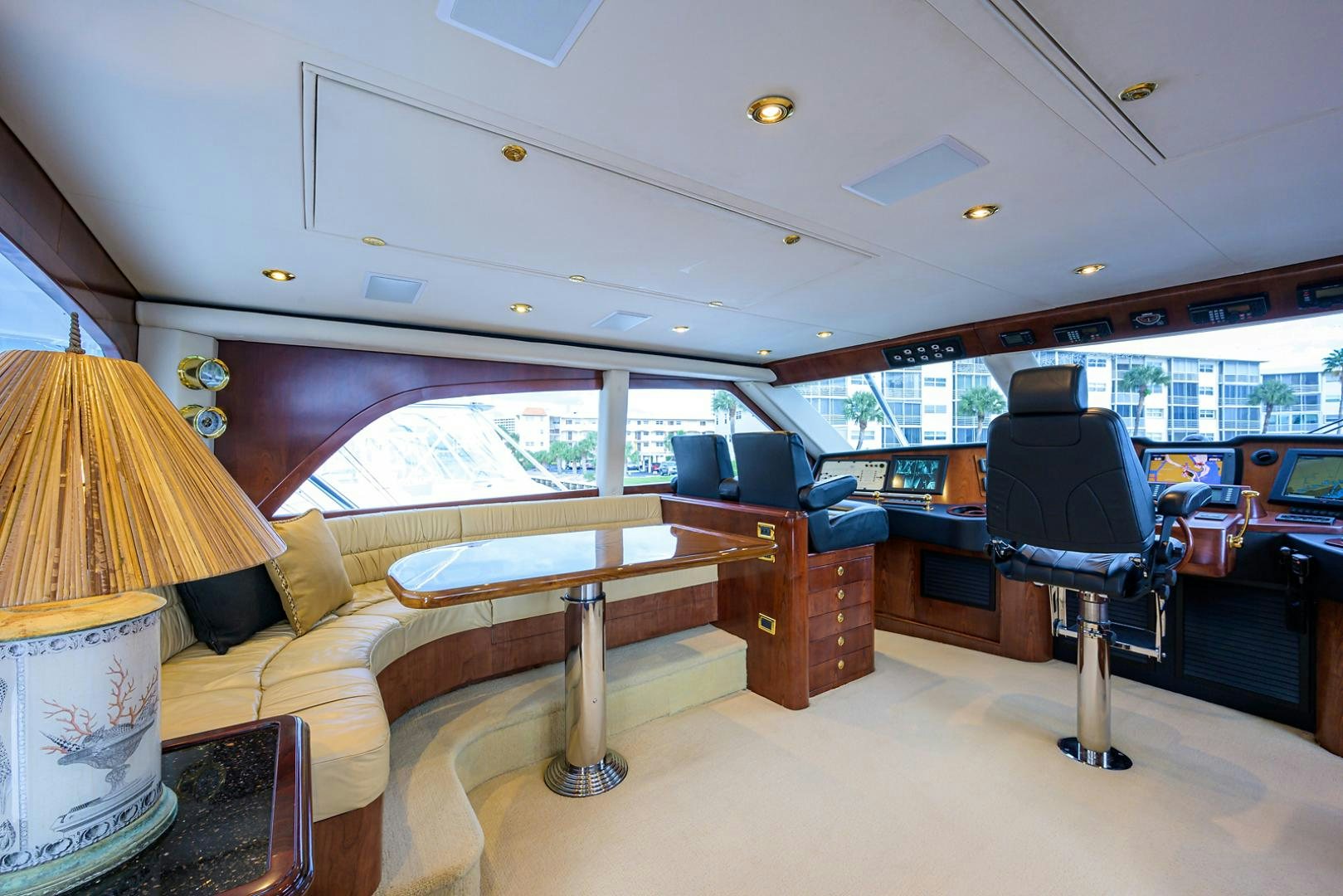 a room with a couch and a table and a chair aboard BLACK SHADOW Yacht for Sale