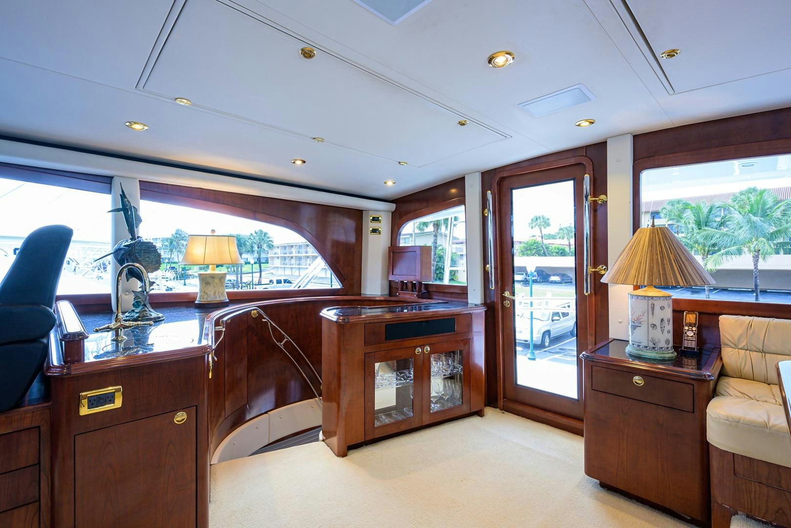 a living room with a large window aboard BLACK SHADOW Yacht for Sale