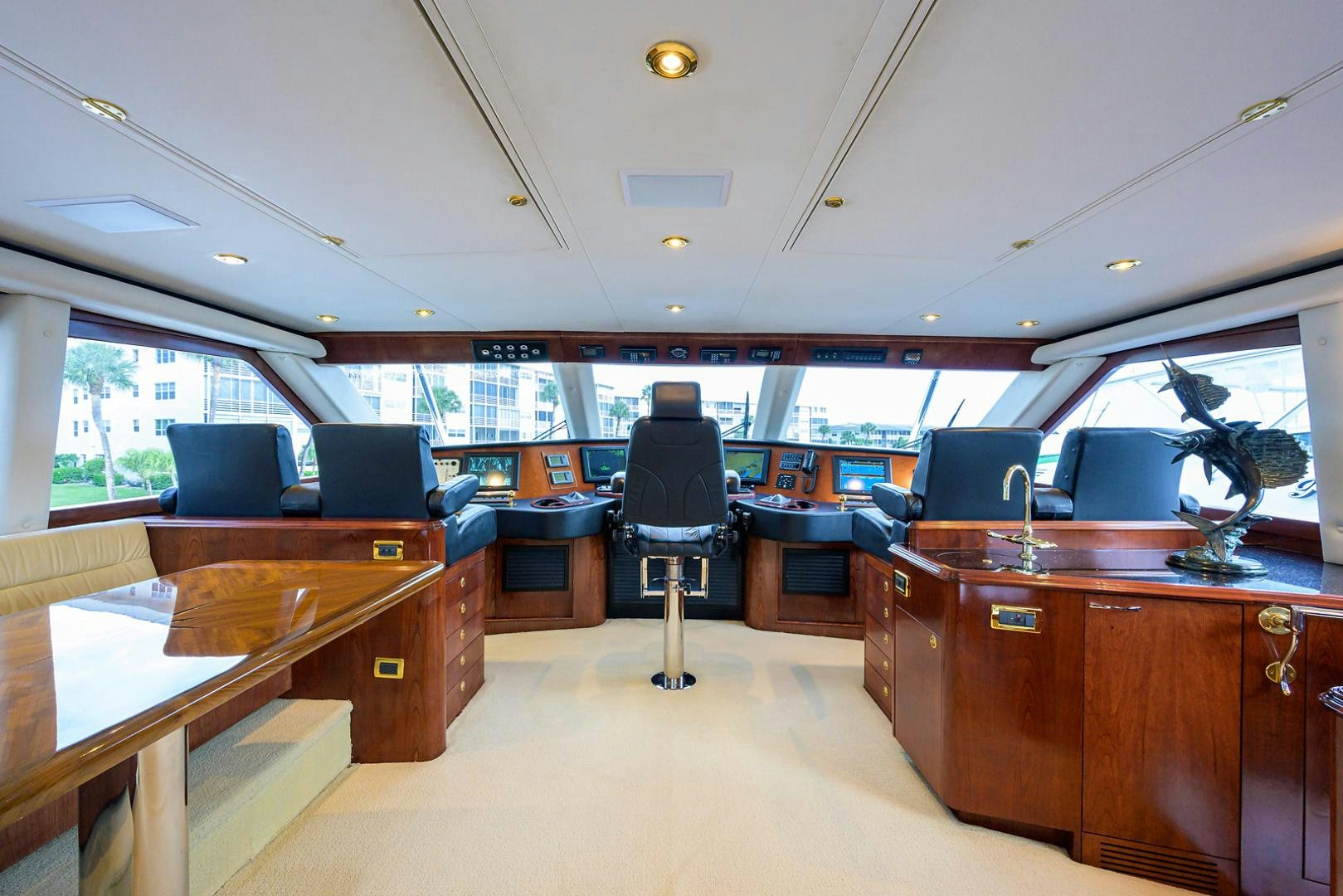 a room with a desk and chairs aboard BLACK SHADOW Yacht for Sale