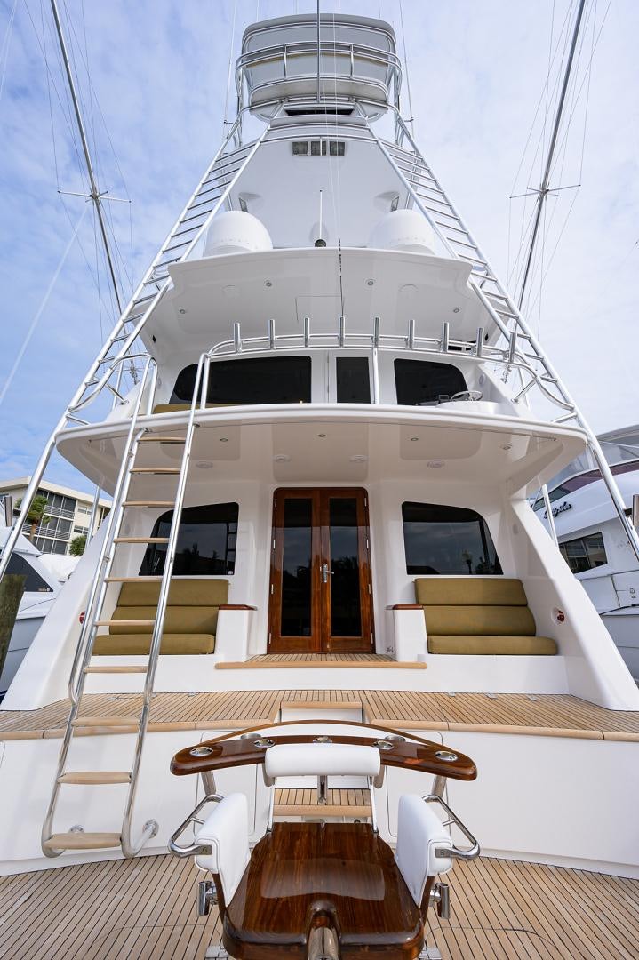a white boat with a deck aboard BLACK SHADOW Yacht for Sale
