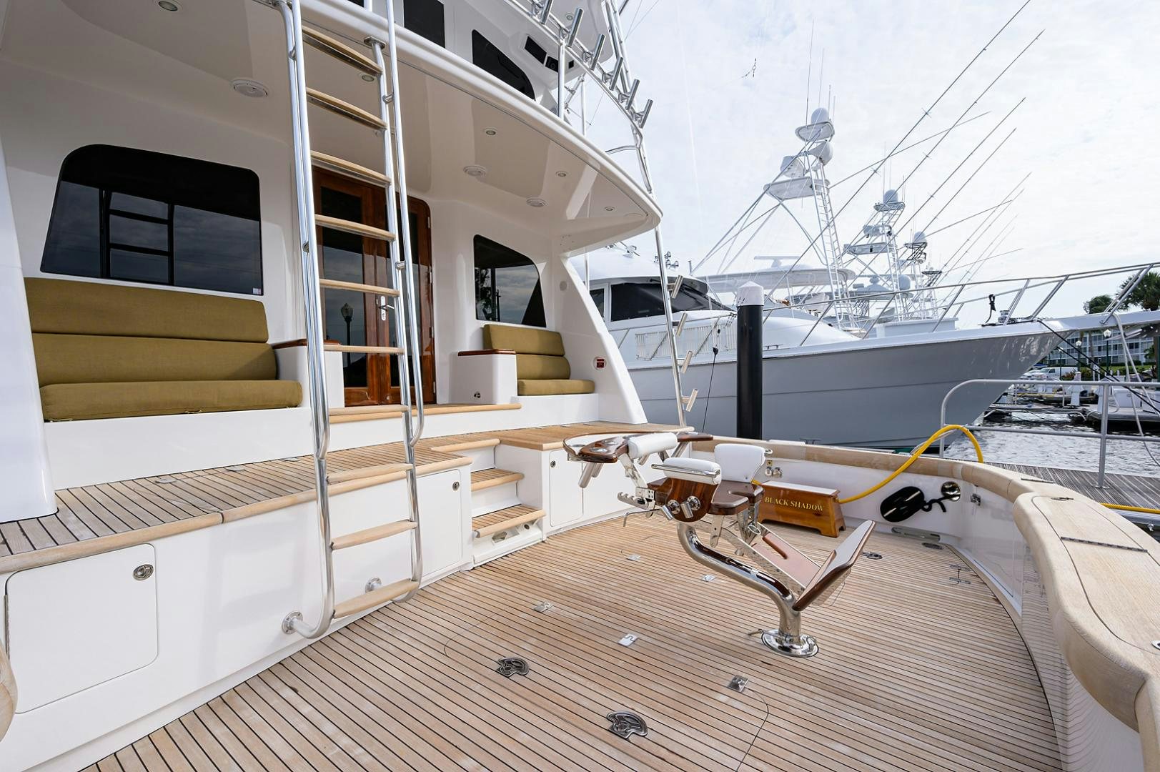a deck with a deck and a boat on it aboard BLACK SHADOW Yacht for Sale