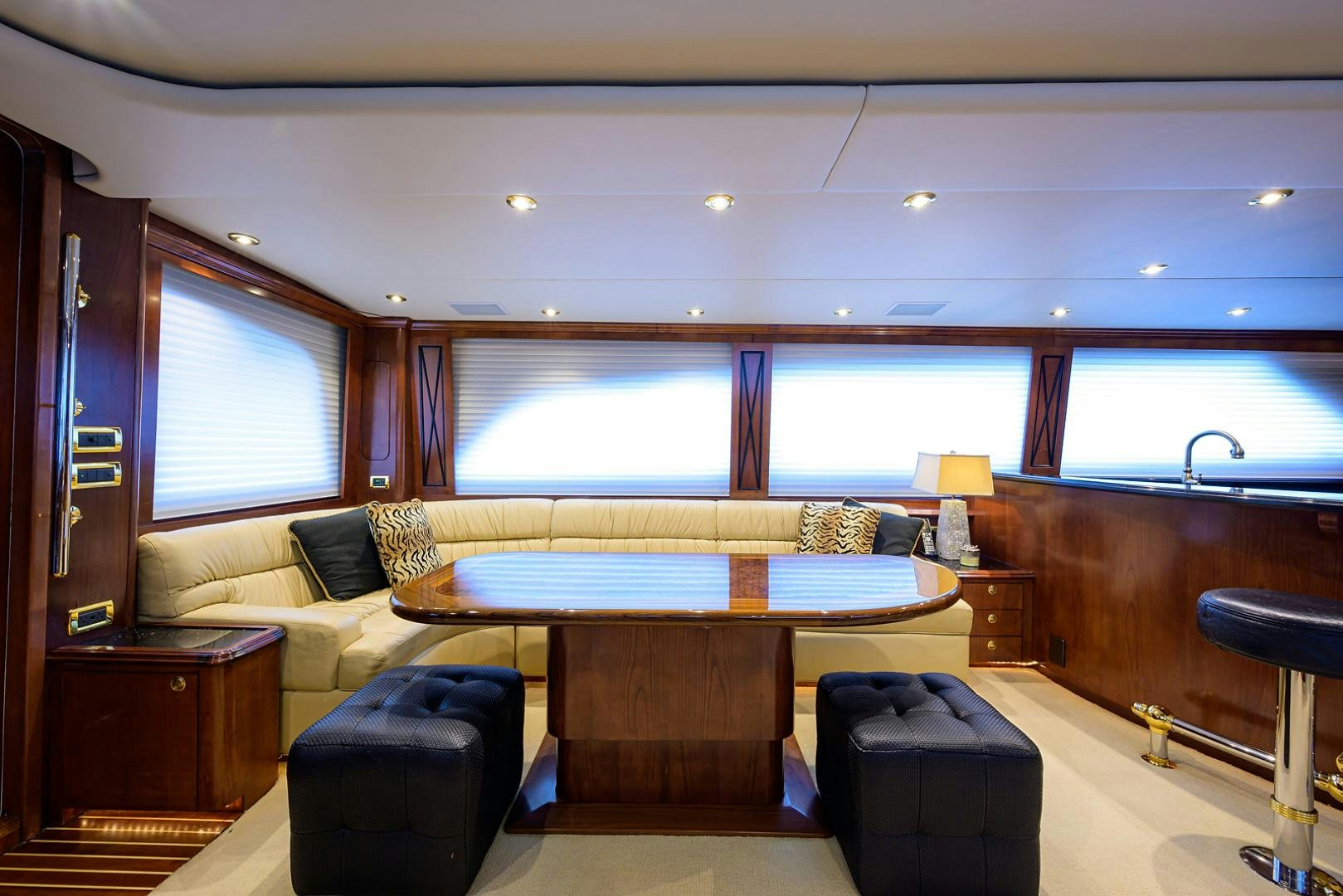 a room with a table and chairs aboard BLACK SHADOW Yacht for Sale