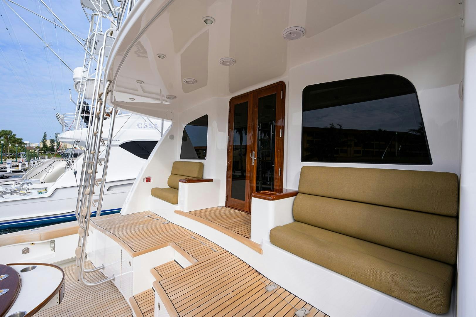 a living room with a couch and a television aboard BLACK SHADOW Yacht for Sale