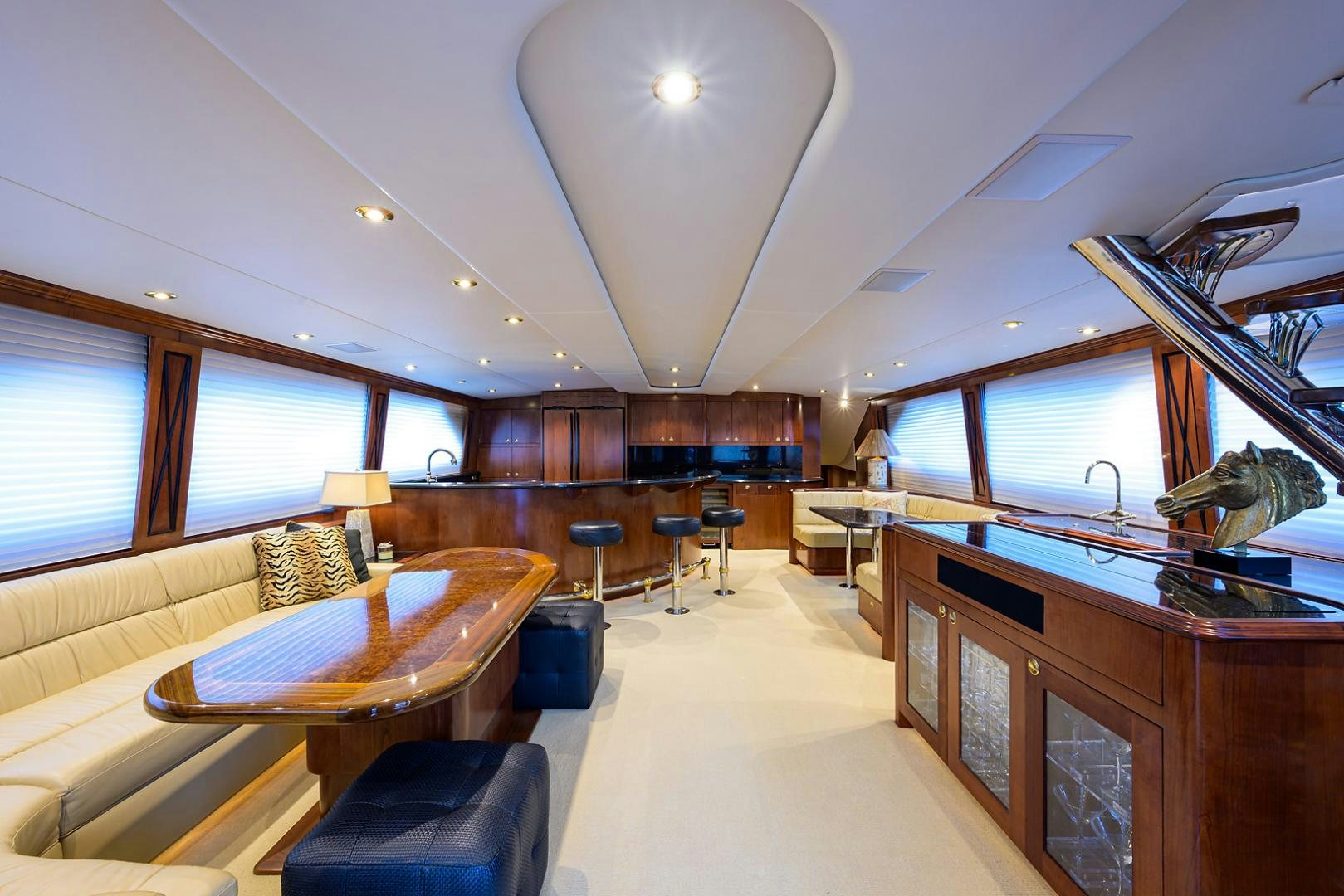a large living room with a large window aboard BLACK SHADOW Yacht for Sale