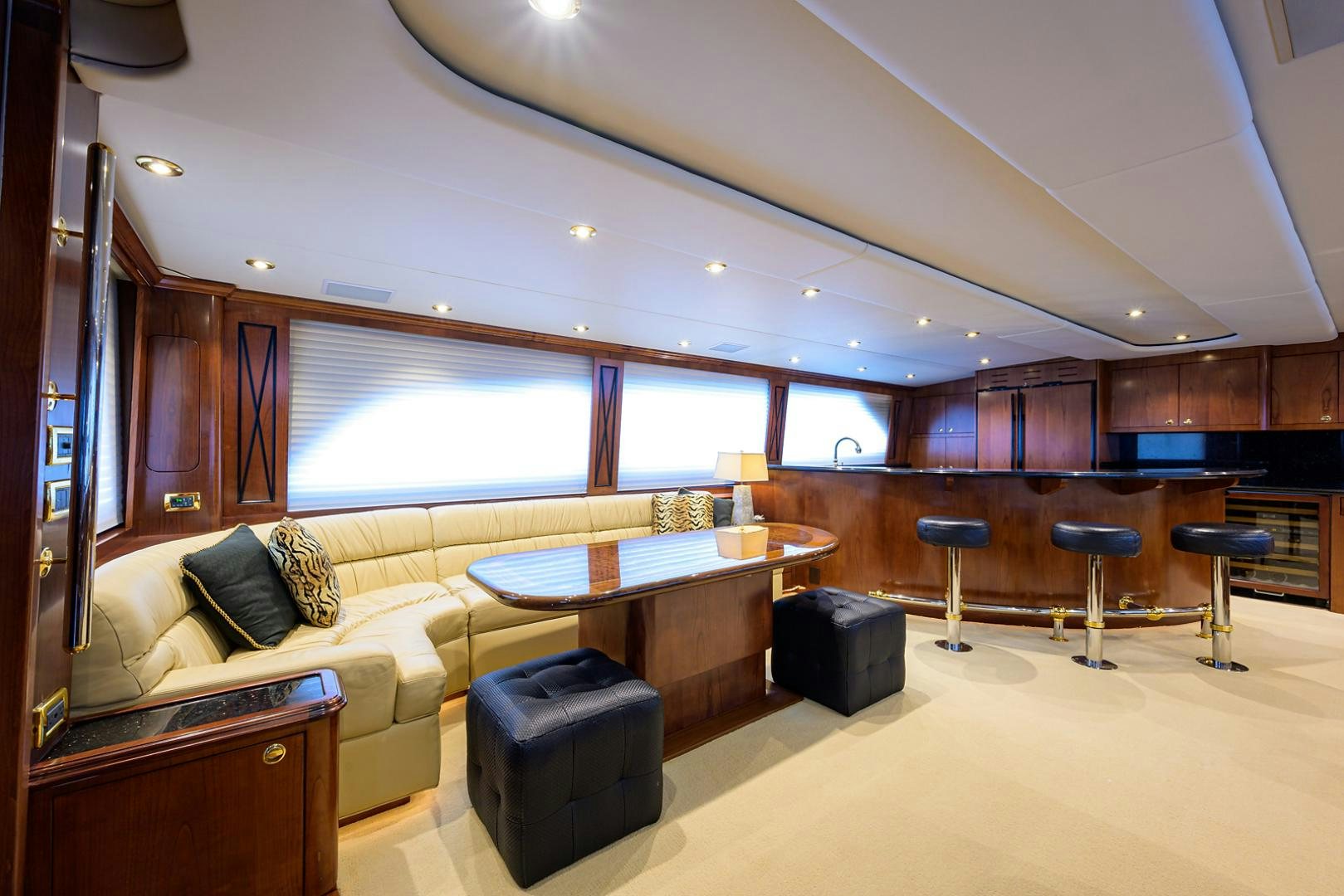 a living room with a couch and a table aboard BLACK SHADOW Yacht for Sale