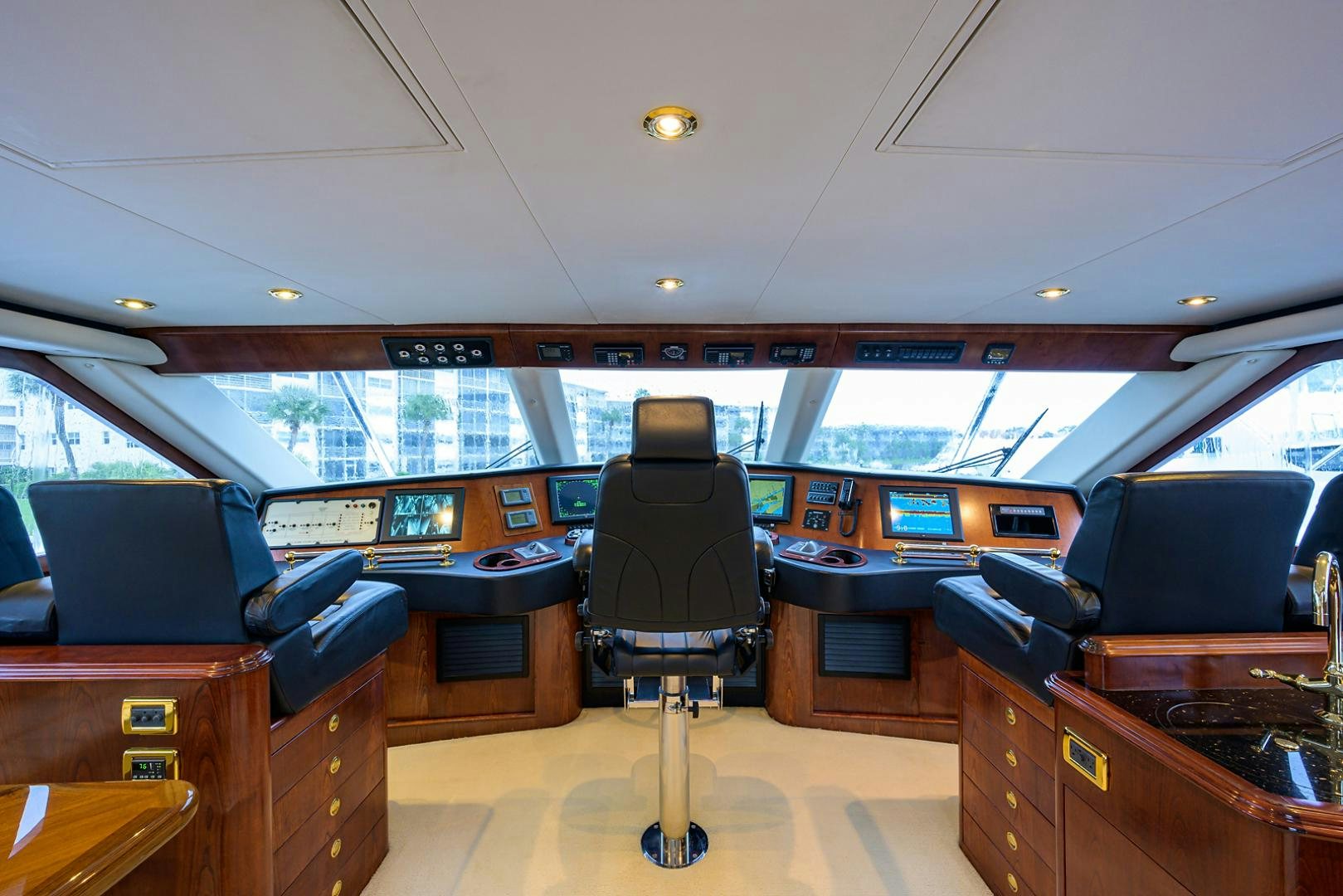 inside of a vehicle with a desk and chairs and a computer aboard BLACK SHADOW Yacht for Sale
