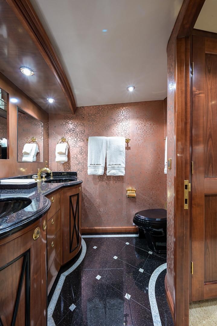 a bathroom with a sink and a mirror aboard BLACK SHADOW Yacht for Sale