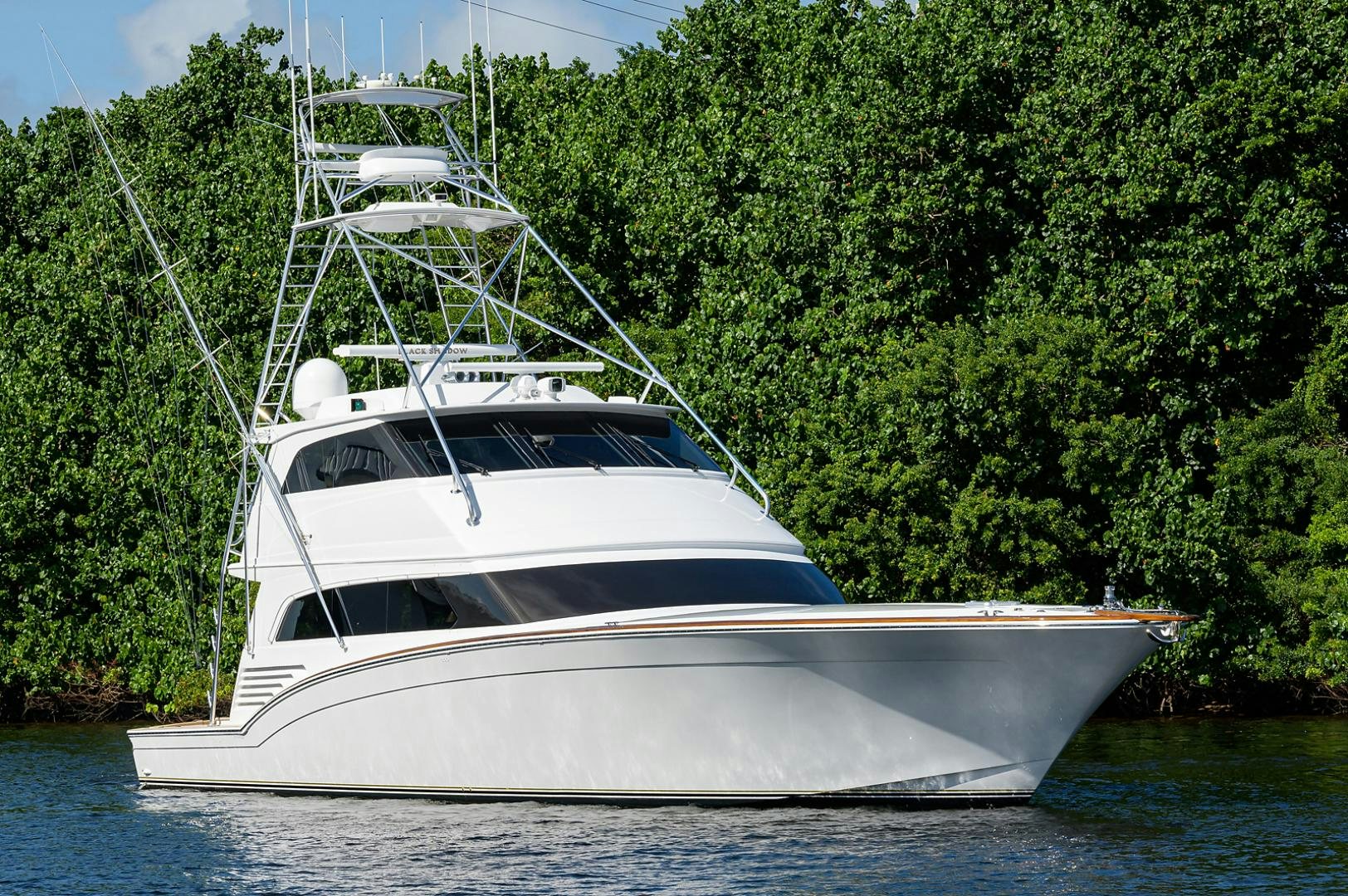 a white boat on water aboard BLACK SHADOW Yacht for Sale