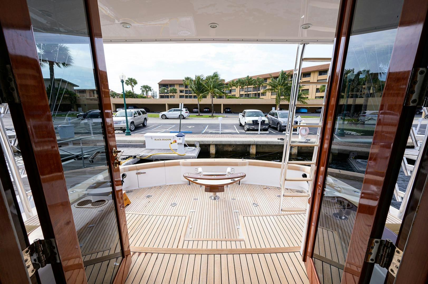 a room with a table and cars aboard BLACK SHADOW Yacht for Sale
