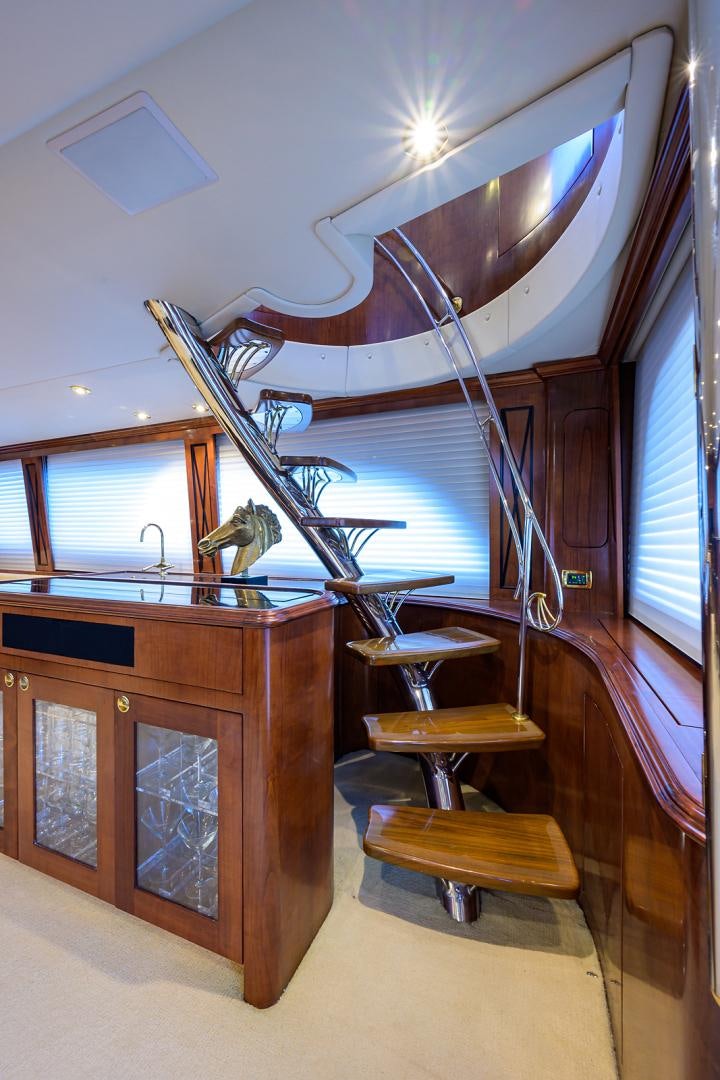 a room with a large ceiling fan aboard BLACK SHADOW Yacht for Sale