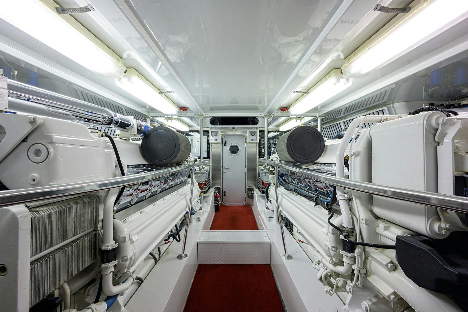 a large room with white machines aboard BLACK SHADOW Yacht for Sale