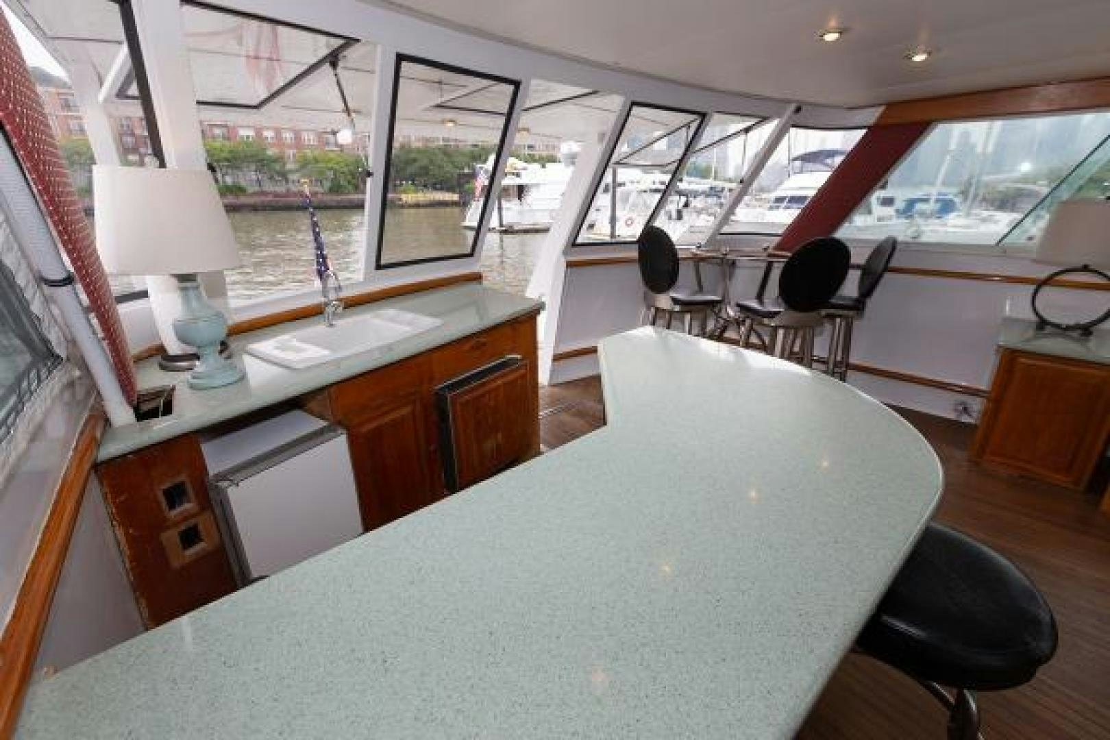 a large white table in a room aboard No Name Yacht for Sale