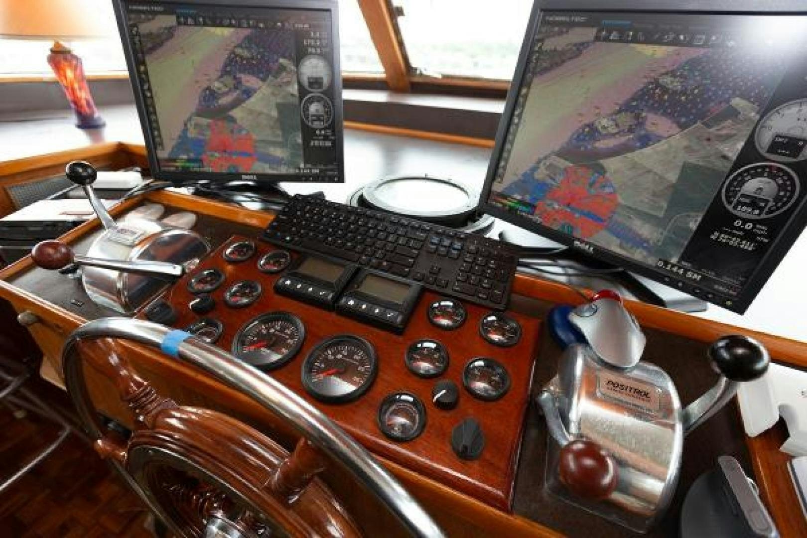 a control panel with a keyboard and other electronics aboard No Name Yacht for Sale