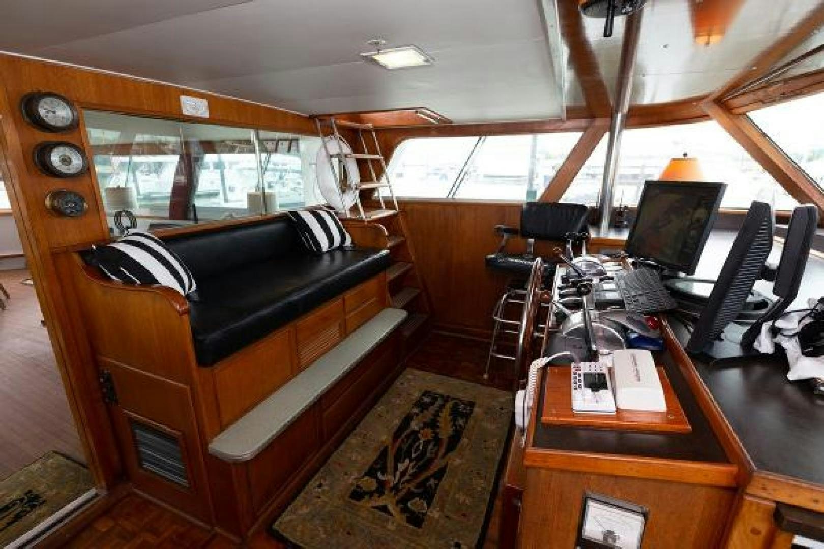 a room with a desk and a computer aboard No Name Yacht for Sale
