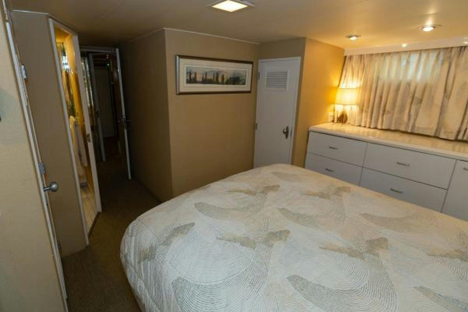 a bedroom with a large bed aboard No Name Yacht for Sale